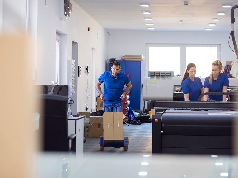 Workers handling packages in a warehouse